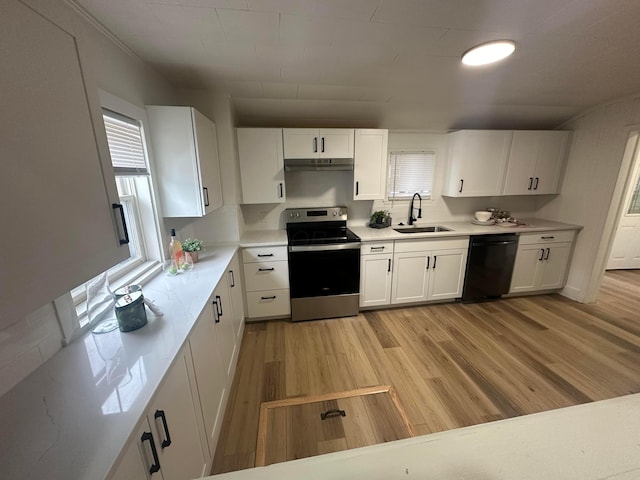 kitchen featuring sink, white cabinetry, stainless steel electric range, light wood-type flooring, and black dishwasher