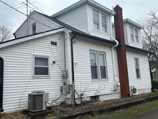 view of home's exterior featuring cooling unit