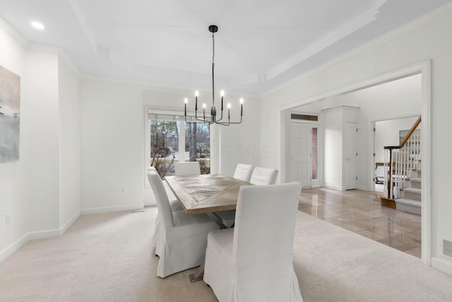 dining room featuring stairway, baseboards, a tray ceiling, ornamental molding, and light carpet