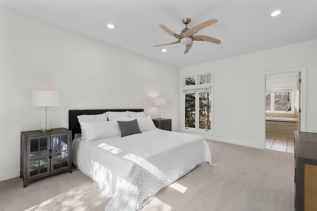 bedroom with recessed lighting, baseboards, and light carpet