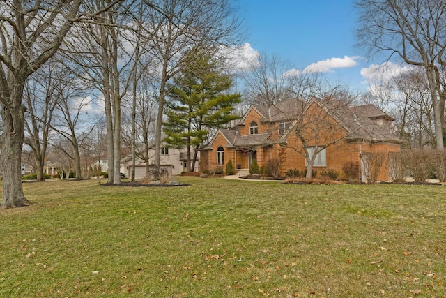 traditional-style house with brick siding and a front yard