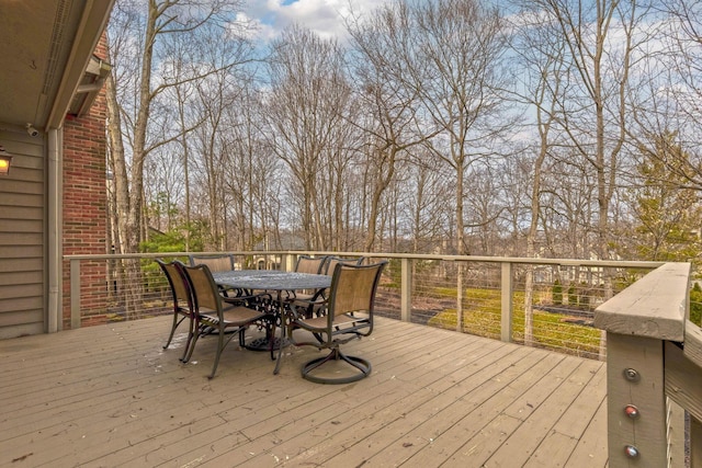 wooden terrace with outdoor dining area