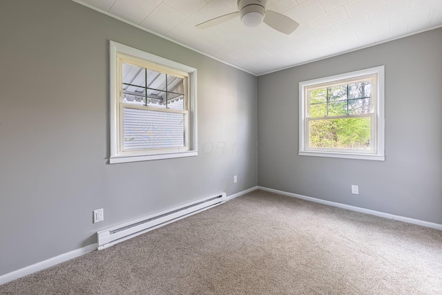 unfurnished room featuring ornamental molding, a baseboard heating unit, baseboards, carpet flooring, and ceiling fan