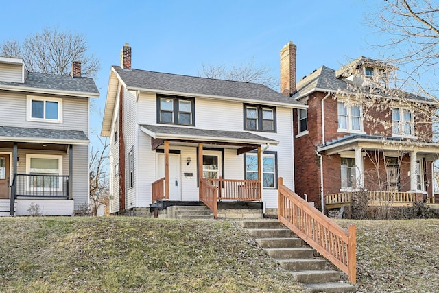 view of front facade with a porch and a front yard