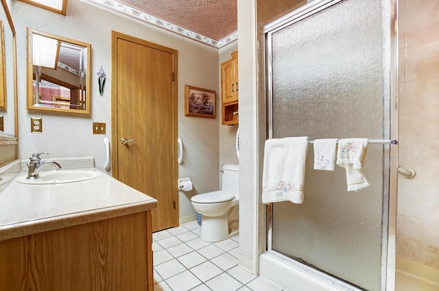 bathroom with vanity, toilet, tile patterned flooring, and a shower with door