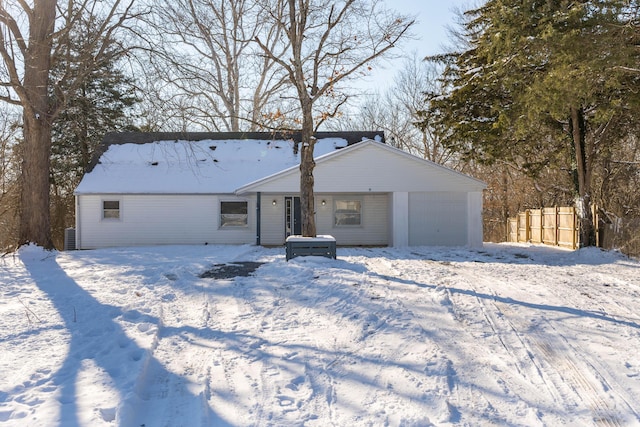 view of snow covered rear of property