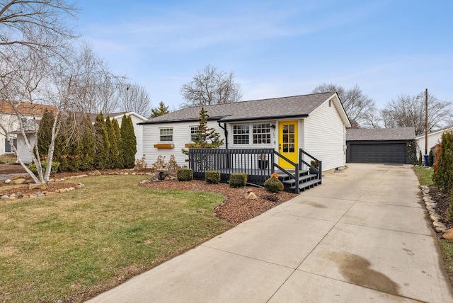 view of front of property with a garage and a front yard