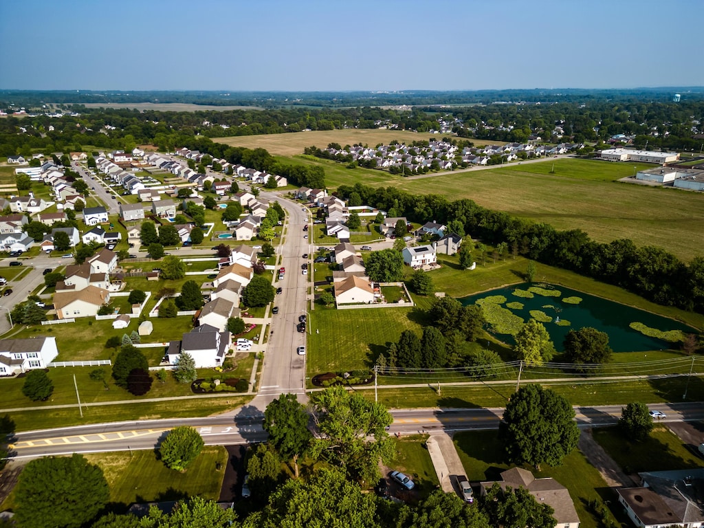 aerial view with a residential view and a water view