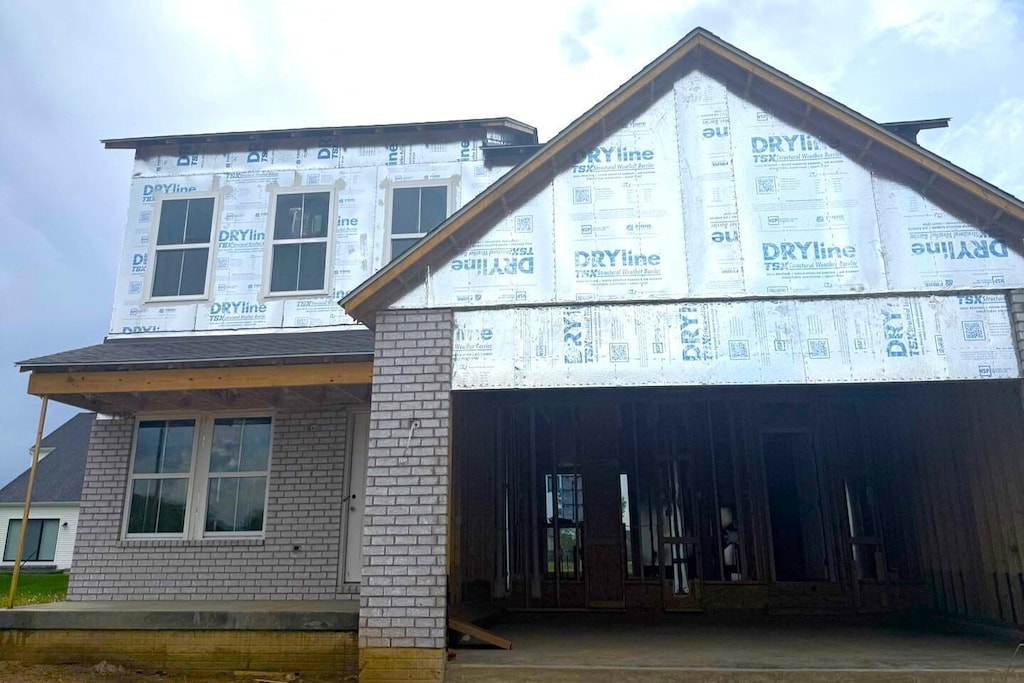 exterior space with brick siding