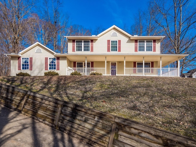 view of front of property with a front lawn and a porch