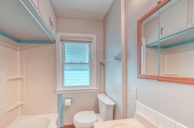 full bath featuring shower / washtub combination, toilet, and vanity