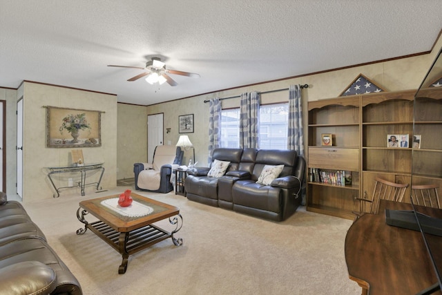 living room featuring crown molding, light colored carpet, ceiling fan, and a textured ceiling