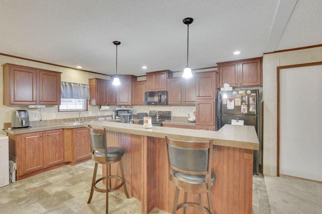 kitchen with pendant lighting, ornamental molding, a center island, and electric stove