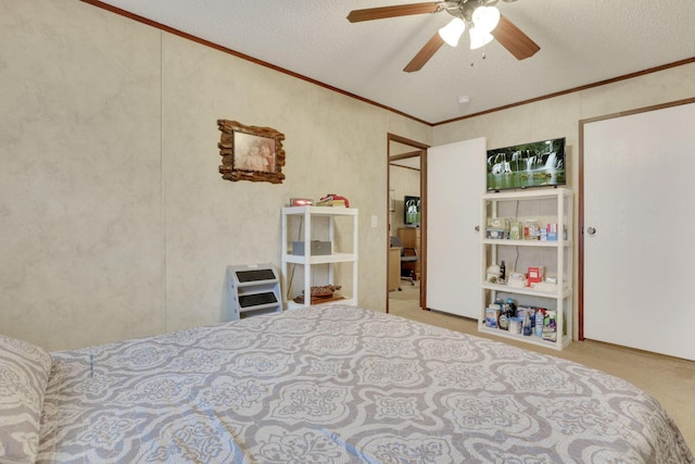 bedroom featuring crown molding, ceiling fan, light carpet, and a textured ceiling