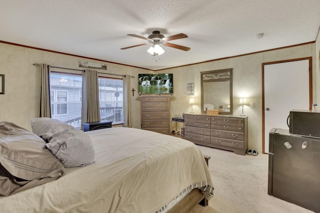 carpeted bedroom with ceiling fan, ornamental molding, and a textured ceiling