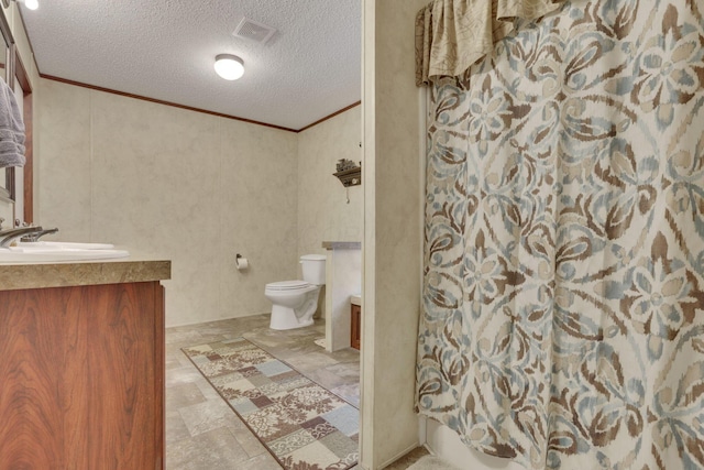 full bathroom with shower / tub combo with curtain, toilet, crown molding, a textured ceiling, and vanity