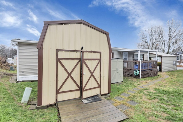 view of outbuilding with a yard