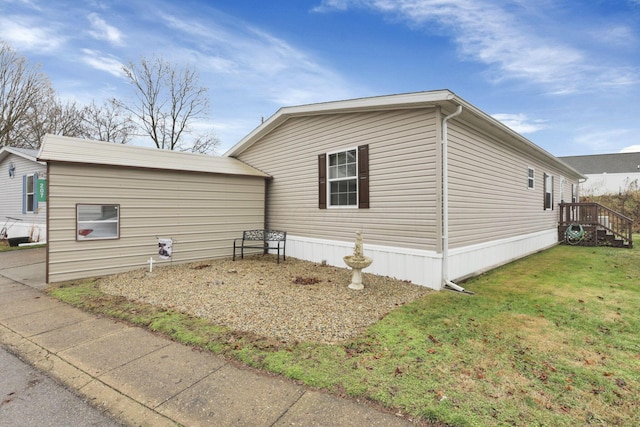 view of property exterior with a yard