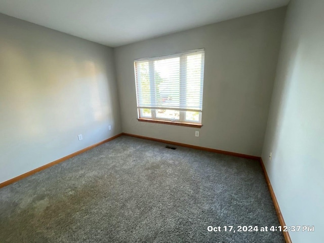 unfurnished room featuring carpet flooring