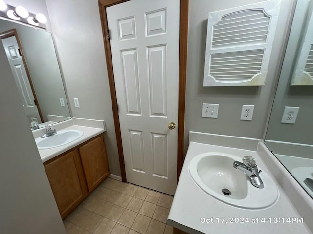 bathroom with tile patterned flooring and vanity