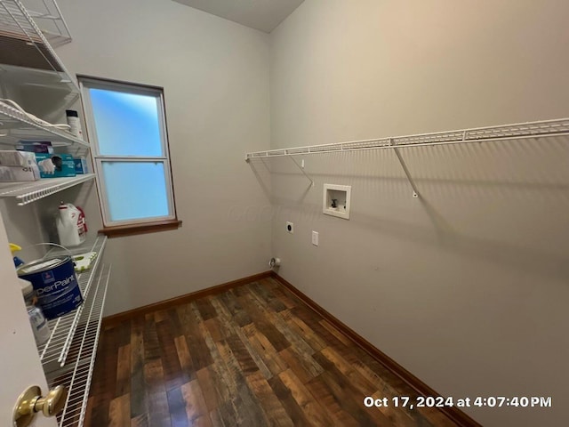 clothes washing area with electric dryer hookup, hookup for a washing machine, and dark hardwood / wood-style floors