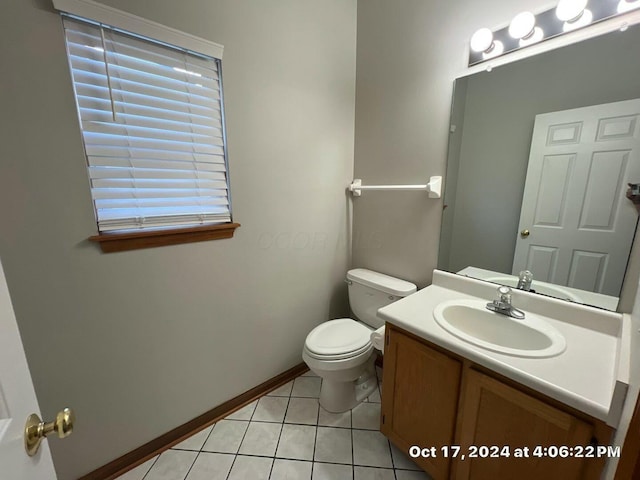 bathroom with tile patterned floors, toilet, and vanity