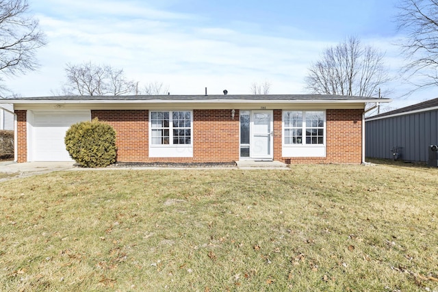 single story home featuring a front yard and a garage