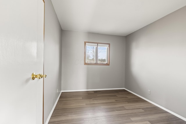 unfurnished room featuring hardwood / wood-style floors