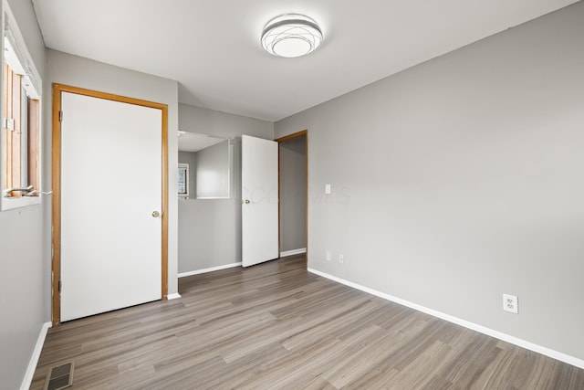 unfurnished bedroom featuring light hardwood / wood-style floors