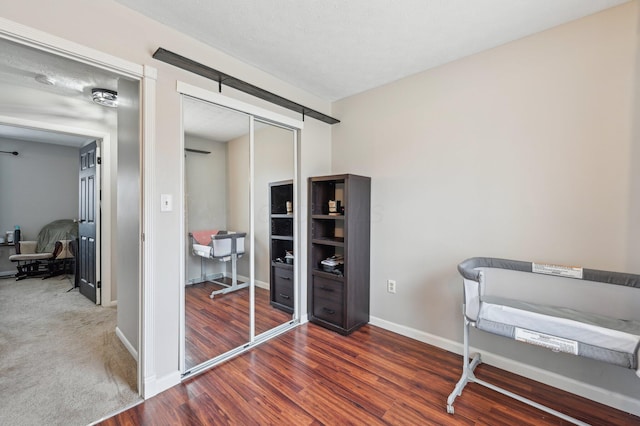 bedroom featuring dark wood-type flooring