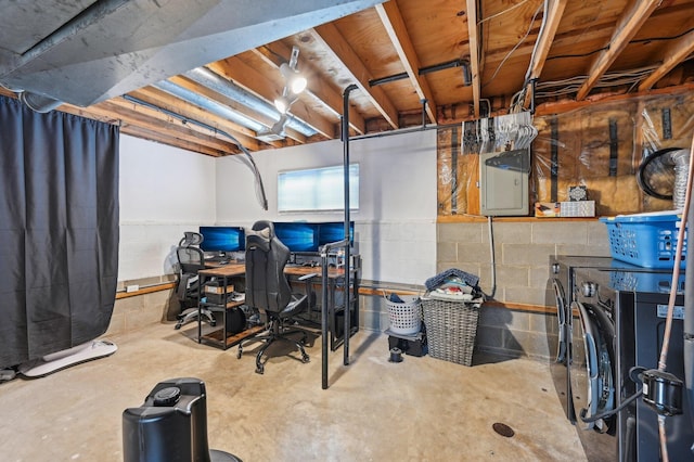 basement with separate washer and dryer and electric panel