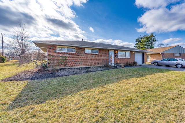 single story home featuring a garage and a front yard