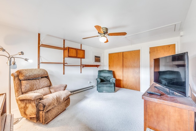 carpeted living room featuring a baseboard heating unit