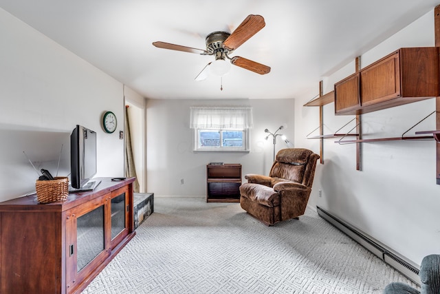 living area featuring a baseboard radiator, light colored carpet, and ceiling fan