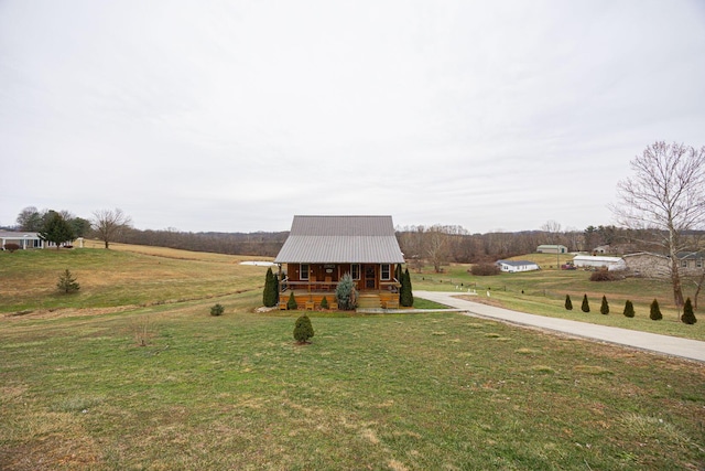 exterior space with a lawn and a rural view