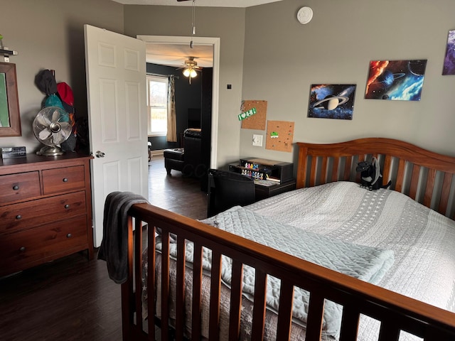 bedroom featuring dark wood-type flooring