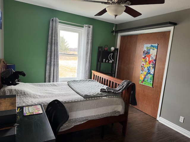 bedroom featuring ceiling fan and dark hardwood / wood-style flooring