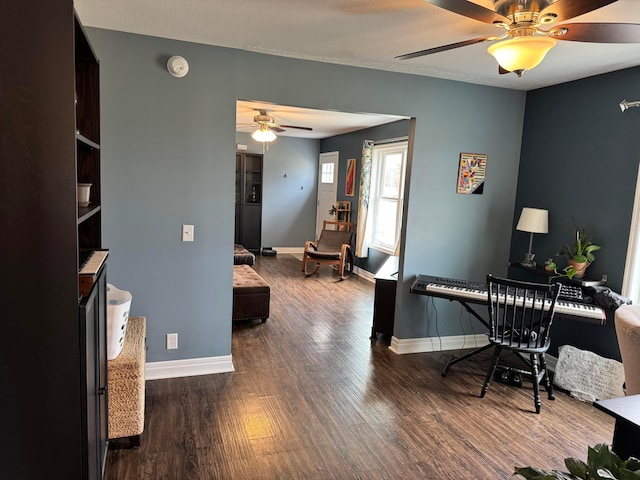 office with dark hardwood / wood-style floors and ceiling fan