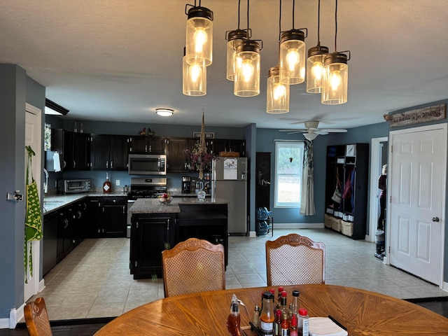 dining area featuring light tile patterned floors and ceiling fan