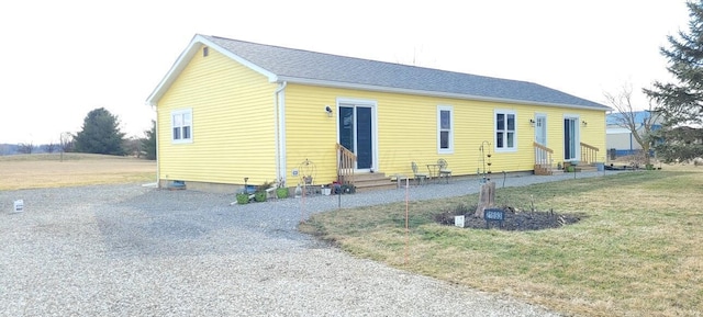 exterior space featuring a front lawn