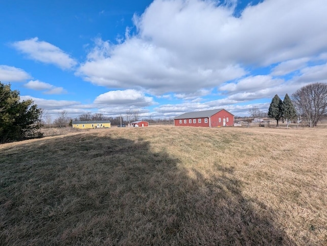 view of yard with a rural view