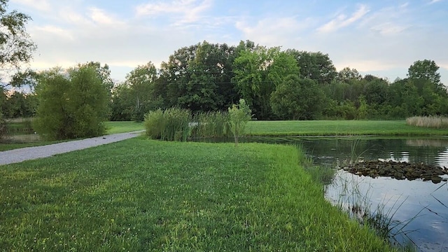 exterior space with a water view and a yard