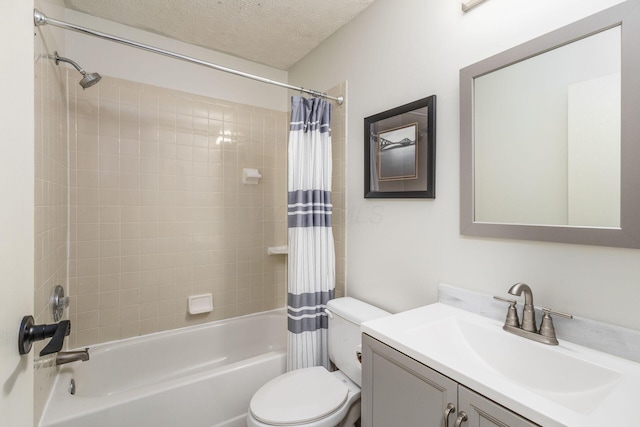 full bathroom with vanity, toilet, shower / bath combination with curtain, and a textured ceiling