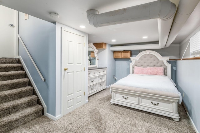 bedroom with light colored carpet