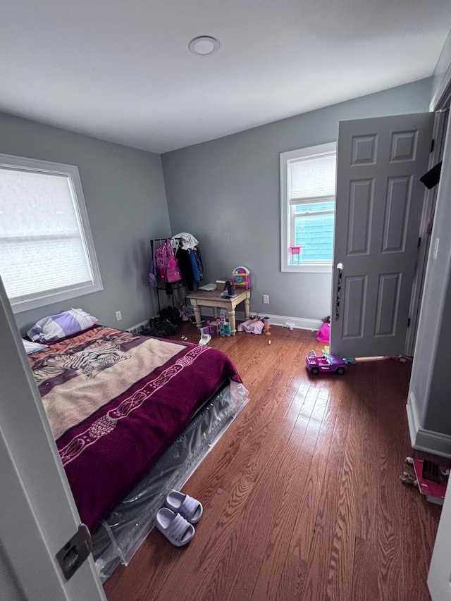 bedroom featuring wood-type flooring