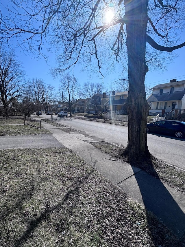 view of road featuring sidewalks and a residential view