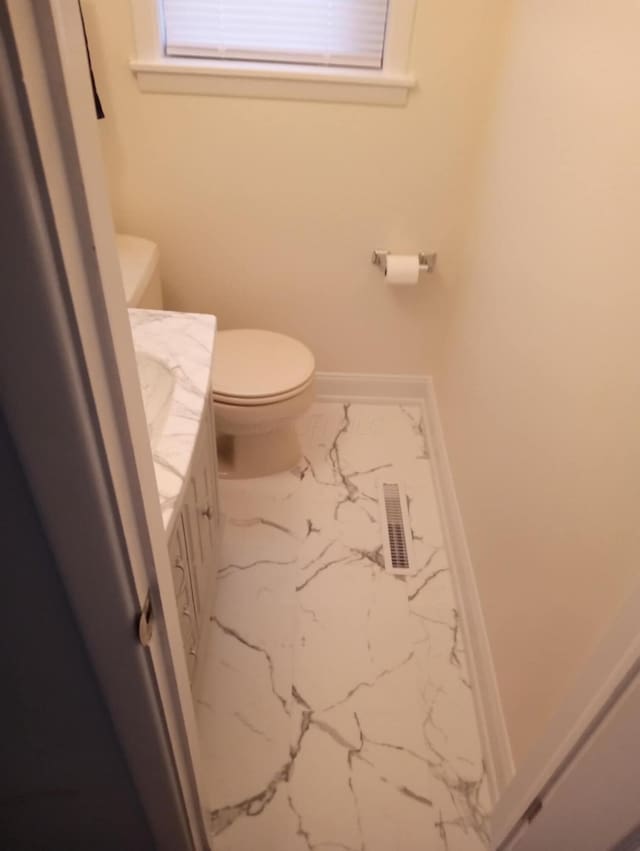 bathroom with vanity and toilet