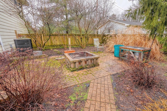 view of yard featuring a patio and an outdoor fire pit