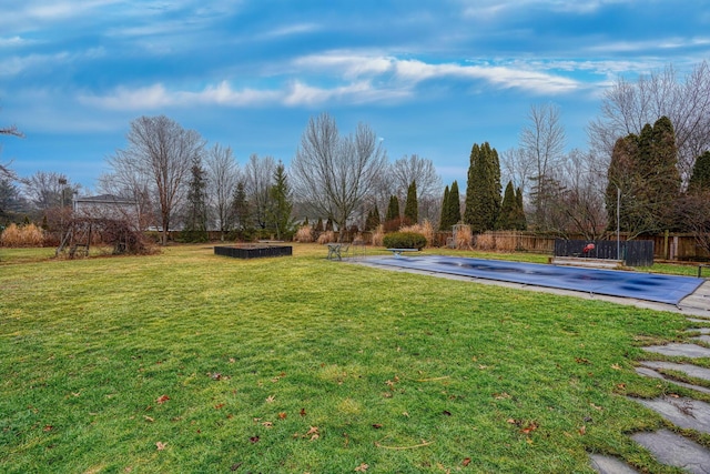 view of yard with a covered pool