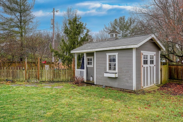 view of outbuilding with a lawn